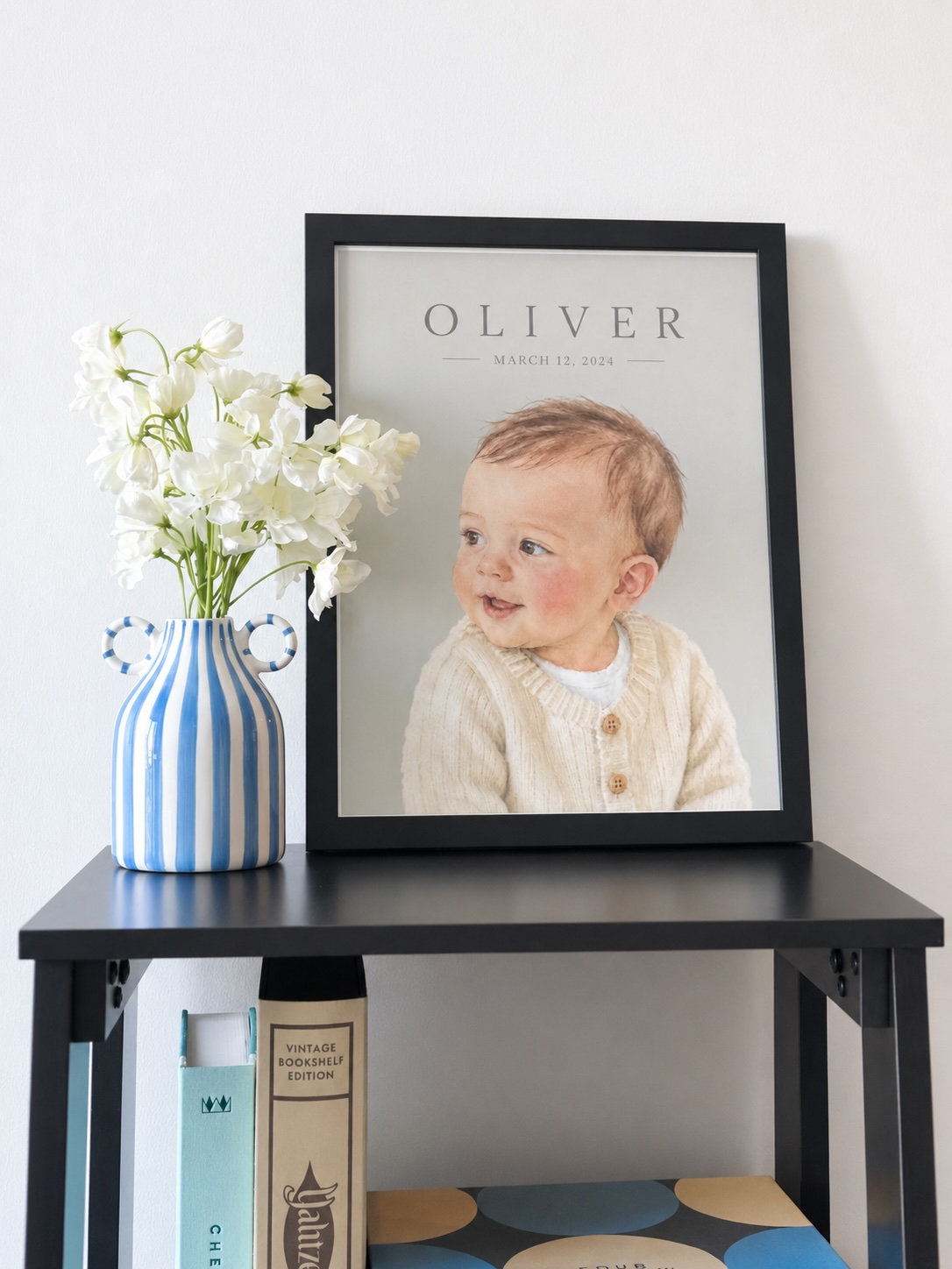 A framed baby portrait displayed in a home